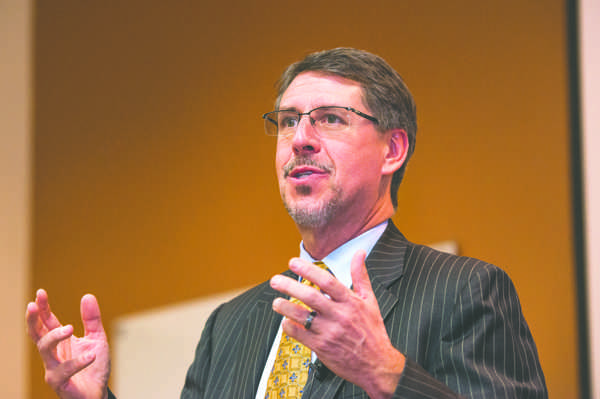 Olsen highlights budget experience, student outcomes