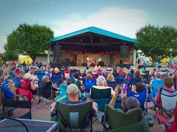 People gather in Downtown Grand Forks as the band performs. Photo courtesy of downtowngrandforks.org