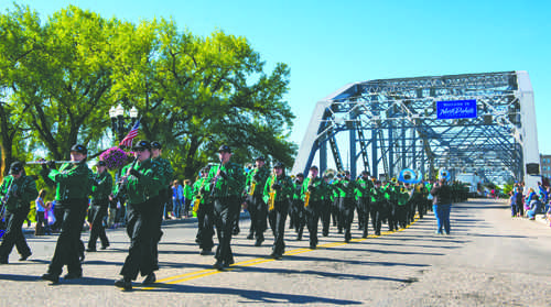 The UND Pride of the North marching band crosses the Sorlie Bridge into East Grand Forks during the Potato Bowl Parade on Saturday, September 18, 2016. Photo by Nick Nelson/ The Dakota Student