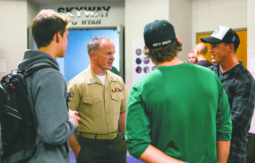 United States Marine Corps Captain Chris Cory (center) speaks with UND students (from left) Henry Berning, Daniel Lockhert and Nicholas Libert during an informational meeting at Clifford Hall on Monday, September 12, 2016. Photo by Nick Nelson/ The Dakota Student