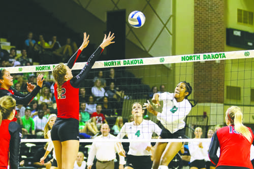 Middle hitter Jordan Vail spikes the ball against Texas Techs Katy Keenan on Friday, September 3, 2016 at the Betty. The Fighting Hawks lost 3-0 against the Lady Raiders.
Photo by Nick Nelson/ The Dakota Student