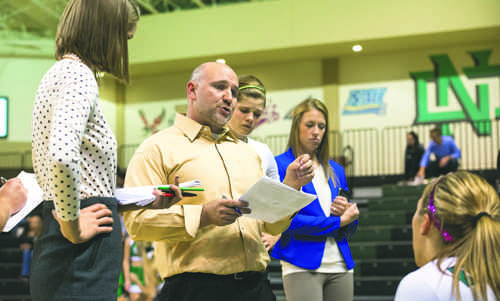 Volleyball head coach Mark Pryor speaks to players during a timeout against Montana State University at the Betty Engelstad Sioux Center on Saturday, October 3, 2015. Photo by Nick Nelson/ The Dakota Student