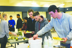 UND students line up for tacos during a hispanic heritage event at the Memorial Union ballroom on Wednesday.