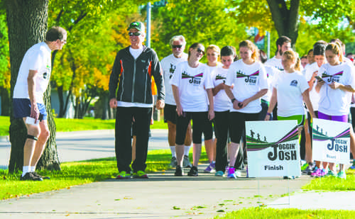 Dean Joshua Wynne starts the Jogging With Josh event outside the new Medical School on Friday, September 30, 2016.