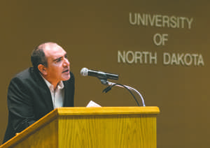 Aaron Poochigan presented a brief reading of an original work during a reception in his honor Friday at the Memorial Union.