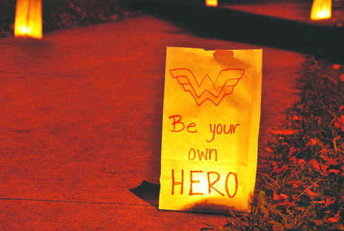 Luminaries light a path for students to walk during Thursdays Take Back The Night rally.