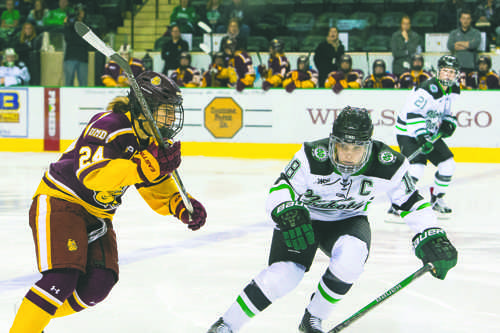 Halli Krzyzaniak intercepts University of Minnesota Duluth forward Michela Cava during a game at the Betty Engelstad Sioux Center last season.