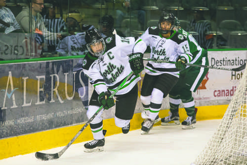 Halli Krzyzaniak drives the puck against Bemidji State University last season at the Ralph Engelstad Arena.