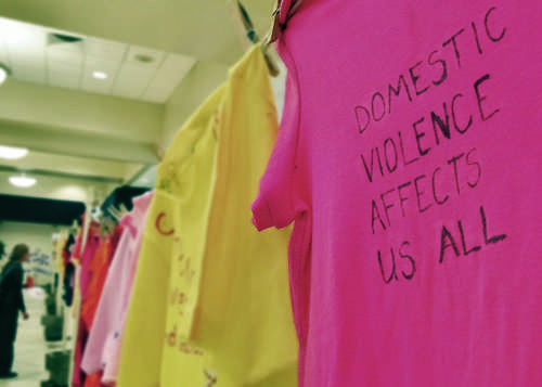 T-shirts in the Clothesline Project are decorated with victim accounts of domestic violence, sexual assault, and/or murder.