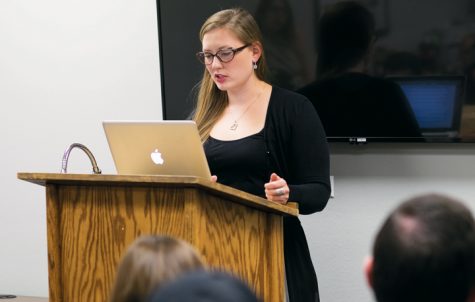 Brittney Christy reads a short story during a graduate series reading event Thursday evening at the Medora Room in the Memorial Union.