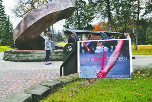 The Red Sand Project, taking place Friday in front of the 'Persistence' statue on campus, aims to raise awareness about human trafficking and other forms of exploitation.