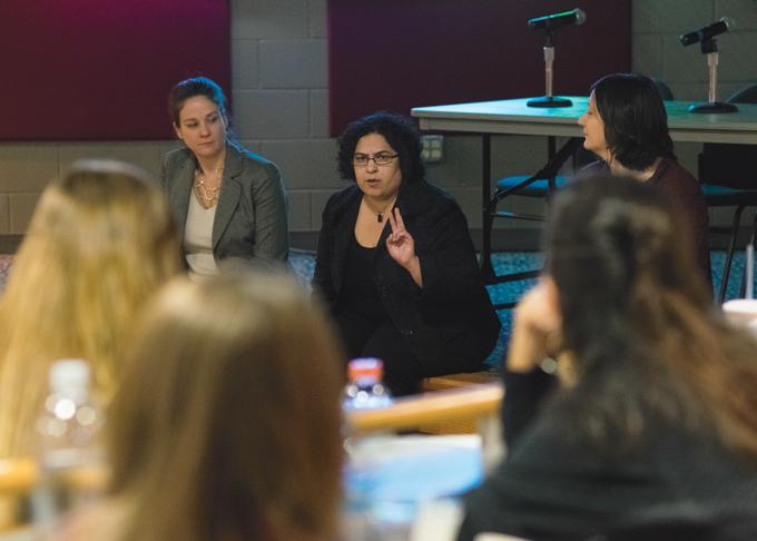 Sabrina Balgamwalla (center), assistant professor of law at UND, speaks during an immigration question and answer event Tuesday afternoon at the Loading Dock.