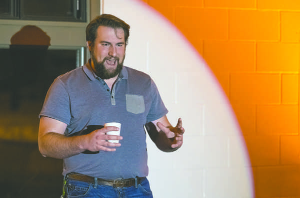 Marcus Wax, UND alumnus  and founder of the Koselig events series, introduces performer Jared Fladeland during Saturdays concert at the University Park warming house. Nick Nelson/ Dakota Student