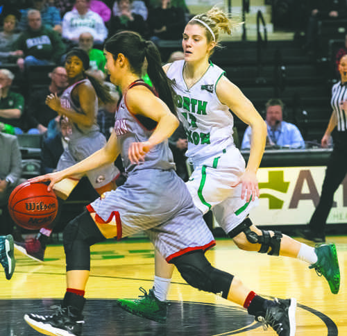 Sophomore guard Grace Sawatzke paces Southern Utah's Rebecca Cardenas at the Betty Engelstad Sioux Center earlier this season. Nick Nelson / Dakota Student