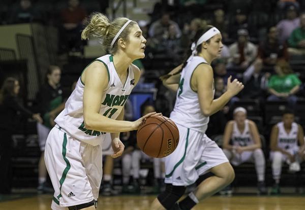 Sophomore guard Grace Sawatzke (left) looks for open players as Fallyn Freije (right) sprints down the court in a game last month at the Betty Engelstad Sioux Center. Nick Nelson/ Dakota Student