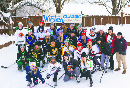 Members of the UND women's hockey team pose for a team photo after competing in the annual Peter's Winter Classic event on Jan. 16, 2017. Nick Nelson/ Dakota Student