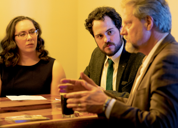 UND english lecturer David Haeselin (center), who edited the recent anthology work Haunted By Waters, listens to UND social work professor Bret Weber (right) during a discussion of the work at Rhombus Guys Brewery on Thursday, April 20, 2017.