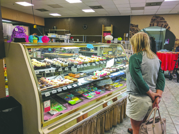 Customers peruse baked goods at O For Heavens Cakes in the Grand Cities Mall on Friday, August 25, 2017. Nick Nelson/Dakota Student