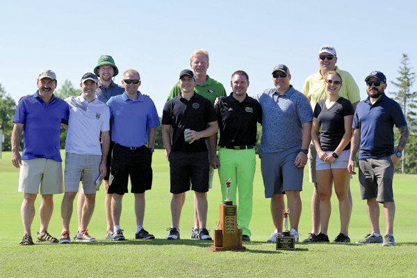 Winners of the Frank White Golf Tournament pose with their trophies on July 8, 2017 at the Walhalla (N.D.) Golf Course. Russ Hons/RussellHons Photography