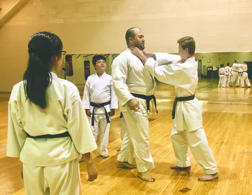 Students spar at Hisshou Karate in the Hyslop Sports Center.