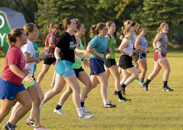 Sweet Demons players perform running drills near the end of Monday's practice at Jaycee's Park.