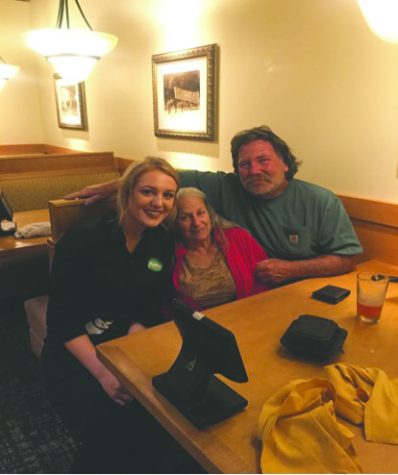 Michaela Schull with the table she served at Olive Garden