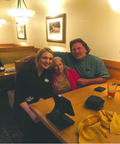 Michaela Schull with the table she served at Olive Garden