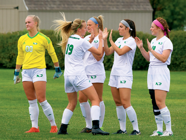 UND soccer defender Erin Svensson (#19) cheers with her teammates prior to a home match against Idaho State on September 22, 2017.