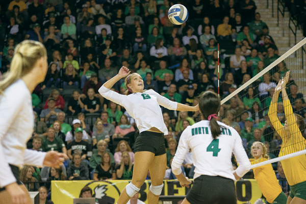 Middle hitter Faith Dooley jumps to spike the ball against NDSU last season at the Betty Engelstad Sioux Center.