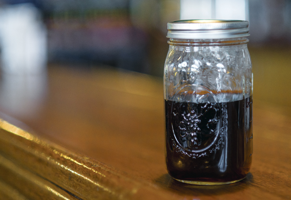 Using mason jars instead of plastic or paper cups to store beverages is an environmentally-friendly way to minimize disposable product use as a result of dining out at restaurants.