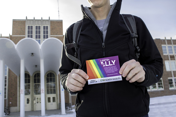 A UND student holds a placard after completing the LGBTQ+ Ally Training Program at the Memorial Union on Friday, January 26, 2018. 