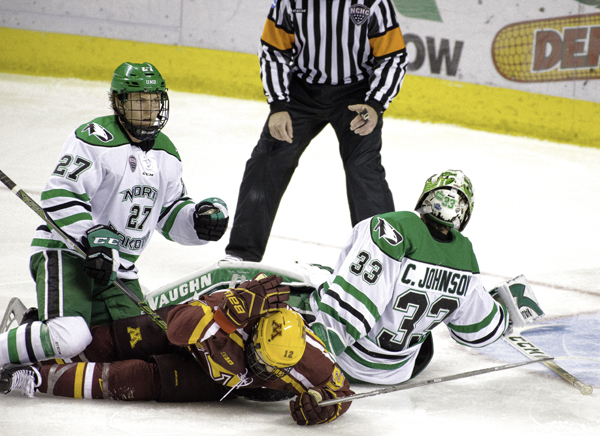 UND forward Ludvig Hoff (#27) watches goalie Cam Johnson makes a save against the Minnesoa Gophers earlier this season. Hoff was named to the Norwegian men's Olympic ice hockey team on Wednesday, January 24, 2018. 