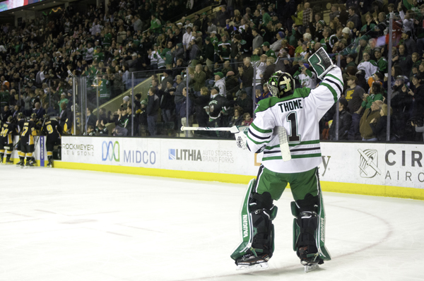 UND goalie Peter Thome celebrates Shane Gersich's goal in the second period of Saturday's hockey game against Colorado College at the Ralph Engelstad Arena. 