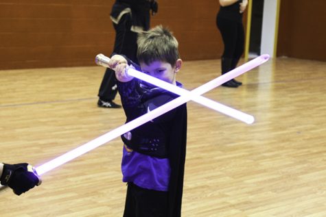 Liam Coons spars with a lightsaber combat instructor at LudoSport Grand Forks on Friday, February 2, 2018. 