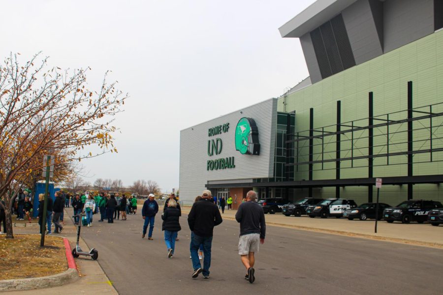 People walk into the Alerus Center in Grand Forks North Dakota