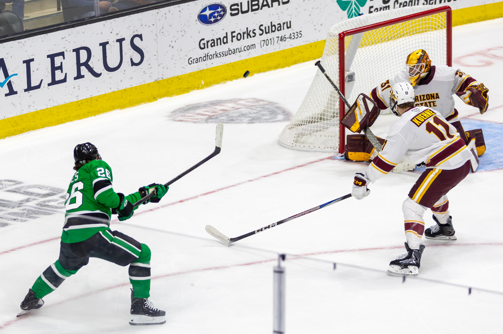 UND's Dylan James taking a shot on the Arizona State goal.