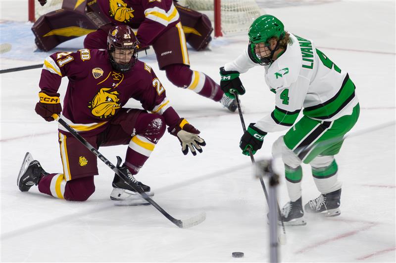 UND's Jake Livanavage handles the puck in the Minnesota Duluth zone.