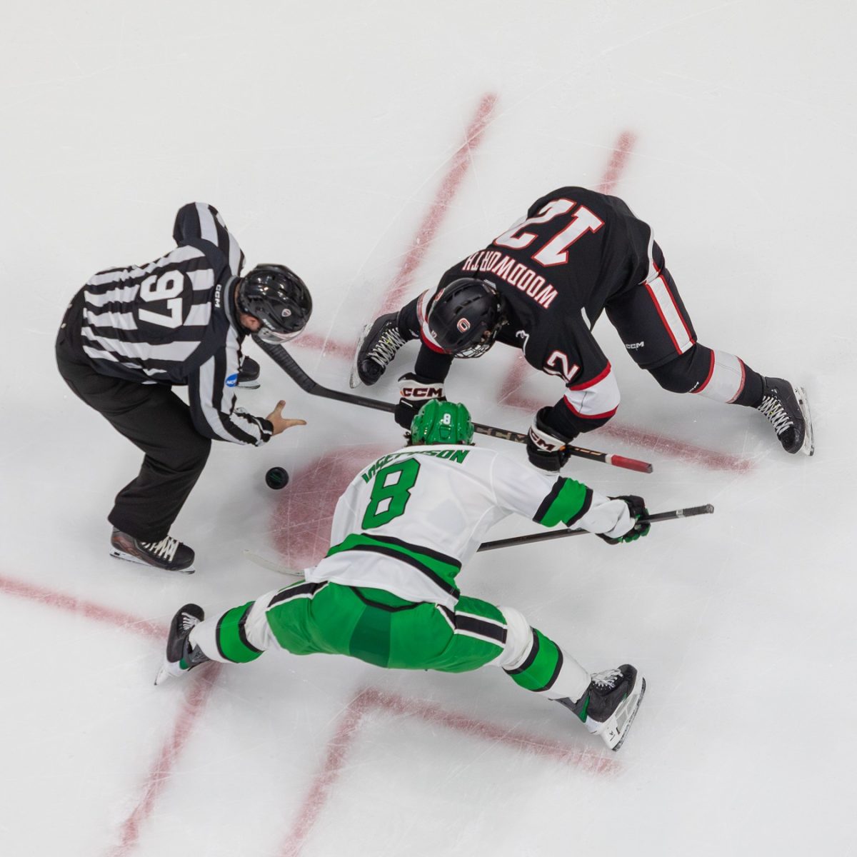 Ollie Josephson (Fr.) takes a faceoff against fellow freshman Luke Woodworth.