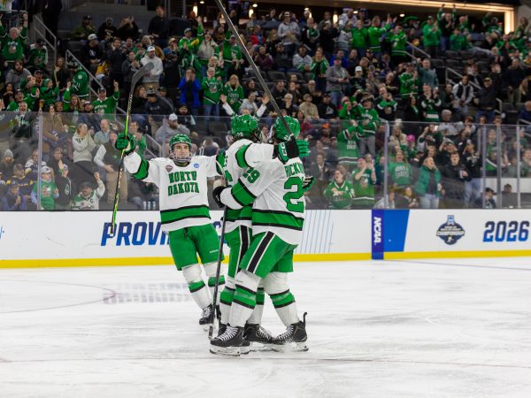 Dylan James, Will Zellers, and Ellis Rickwood celebrate the 4-0 goal.